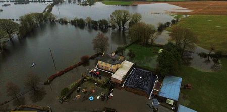 PICS: This Mayo family are living in the middle of a lake after devastating flooding