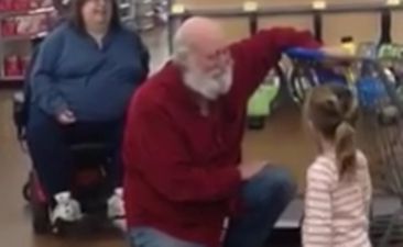 VIDEO: Little girl mistakes a random man in a shop for Santa and he plays along like a hero