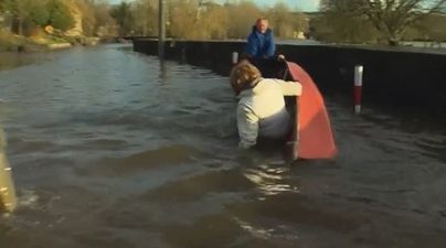 VIDEO: Tánaiste Joan Burton falling out of a boat in Kilkenny floods