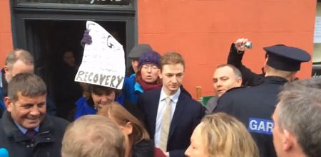 VIDEO: Angry bystanders tell Enda Kenny to “get the f**k out of Wicklow”