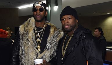 “Broke” 50 Cent posts photos of himself lying in a heap of money