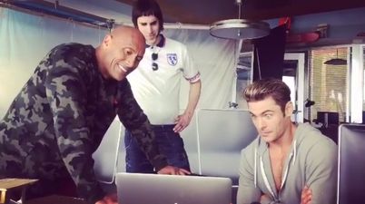 WATCH: Sacha Baron Cohen showing The Rock and Zac Efron THAT elephant scene