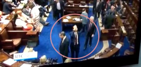VIDEO: Was this TD waving at someone or suggesting going for pints in the Dail yesterday?