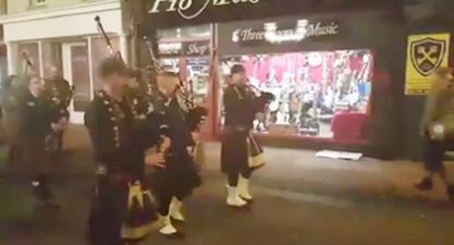 VIDEO: A marching band on a Cork street walk into a pub and continue playing tunes