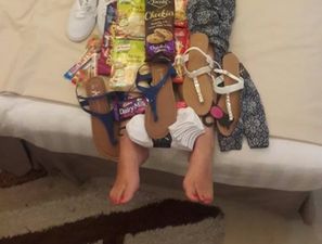 PIC: Clare girl abroad literally wears the absolute motherload of Irish treats sent from home