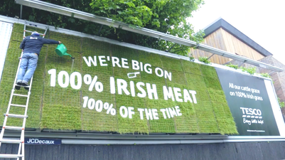 Yes… you did see somebody watering an outdoor advertisement