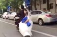 WATCH: Newlyweds go on romantic scooter ride, bride falls off, groom just keeps on going