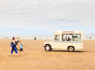 PIC: Ice-cream van on a Derry beach forgets about the tide coming in…