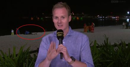 VIDEO: Dan Walker expertly diverts attention from amorous couple in the background live on BBC