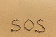 PICS: Couple rescued from deserted island after writing ‘SOS’ in the sand
