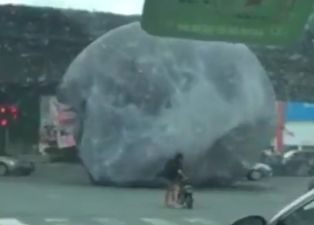 VIDEO: A giant, inflatable moon caused traffic chaos in China today