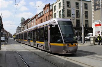 A tour bus has crashed into the Luas in Dublin city centre
