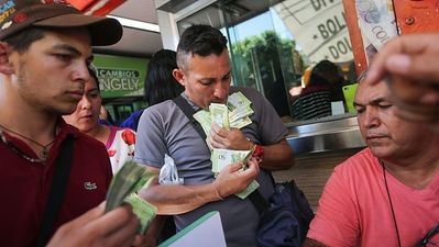 Venezuela’s currency is now worth so little, they’re weighing notes instead of counting them