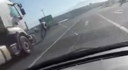 WATCH: Cyclist lucky to be alive after this hair-raising near collision with a lorry
