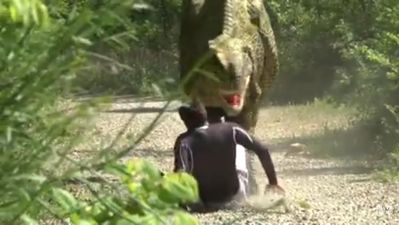 WATCH: Jogger wets himself in fear when faced with a Velociraptor in this Jurassic Prank