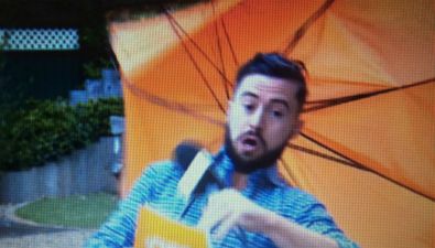 TV3 weatherman reports on strong winds, then gets blown off his feet live on air