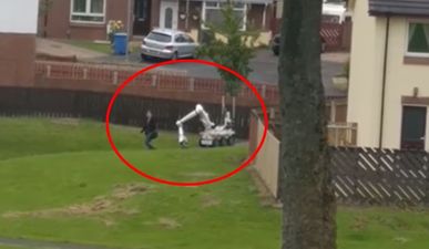 WATCH: Controlled explosion takes place seconds after woman walks past bomb disposal robot in Derry