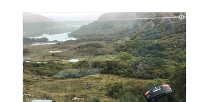 PIC: Tourists in Kerry had a very lucky escape after car left dangling over wall at Ladies View
