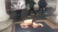 Semi-naked men are laying down in the street to promote men’s mental health awareness