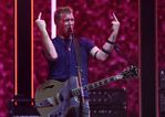Queens Of The Stone Age frontman kicks female photographer in the head during California show