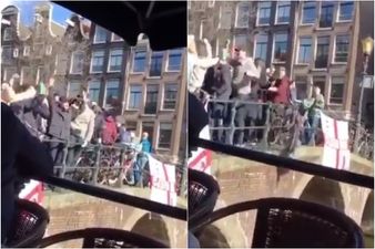 WATCH: English fans filmed launching full cups of booze onto boatful of people and diving into canal in Amsterdam