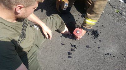 Heatwave causes this man to get his leg stuck in melted tarmac