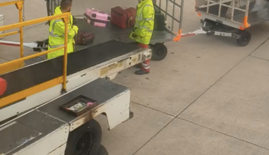 WATCH: Manchester Airport release statement after baggage handlers toss luggage without a care in the world