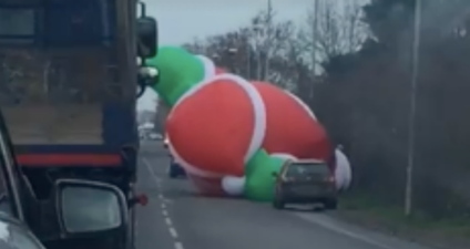 WATCH: Gigantic inflatable Santa goes rogue and holds up traffic
