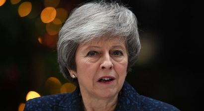Theresa May remains in power after tense party standoff