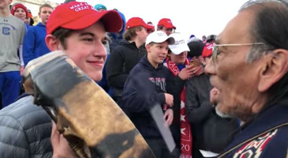 MAGA teenager claims he was defusing the situation after video mocking Native American