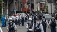 A man and a child have been killed and at least 17 others injured in Japan stabbing attack