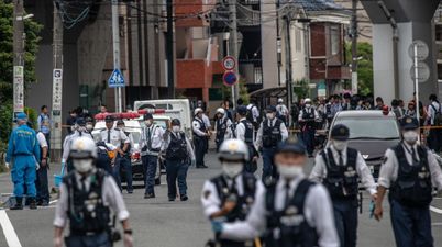 A man and a child have been killed and at least 17 others injured in Japan stabbing attack