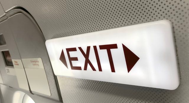 Emergency exit plane toilet