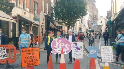 Environmental protestors block cars from driving on busy Dublin street