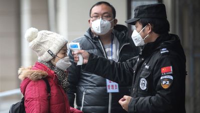 10 Chinese cities locked down and Beijing celebrations scrapped as Wuhan virus death toll rises