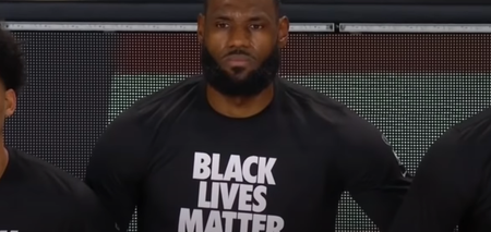 All NBA players and staff take knee during national anthem