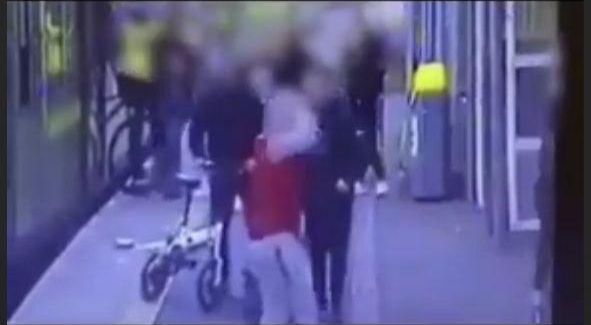 Woman pushed onto train tracks