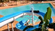 Cow escapes field, heads to resort and gets stuck on water slide