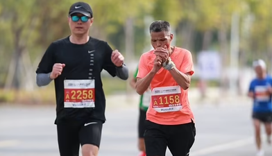 Chinese man runs entire marathon in three and a half hours while chain smoking