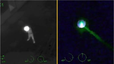 Man shot dead after firing a rifle and pointing laser at police helicopter