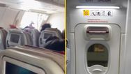Passenger opens plane door mid-flight causing panic on board
