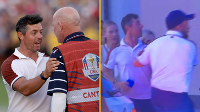 Shane Lowry holds Rory McIlroy back during Ryder Cup car park row