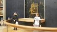 Environmental protesters throw soup at the Mona Lisa painting in Paris