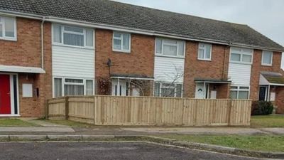 Woman leaves neighbours fuming after building 100ft fence around garden