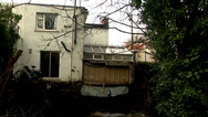 Calls for emergency works to be carried out after property collapses into River Camac