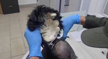 Man arrested after attempting to smuggle £8,000 of cocaine through airport under his wig